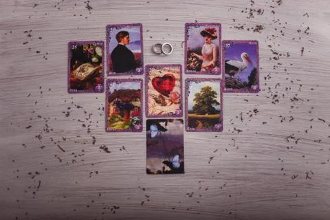 Divination cards alignment in the heart shape for love and family. Stock Photos