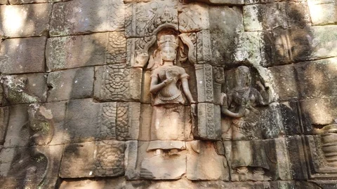 Divine dancer Apsara carved on a stone Stock Footage 105984722