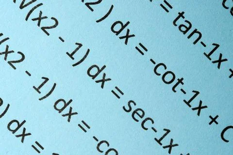 Divine equations unfold on pale blue paper in a quiet study Stock Photos
