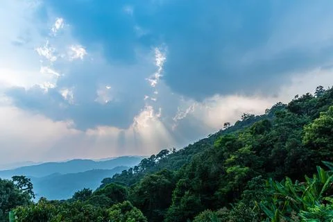 Divine glow through the clouds of the evening warm sun. Concept of peace an.. Stock Photos