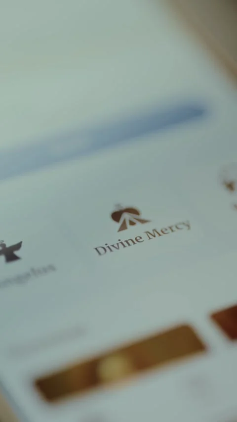 Divine Mercy Catholic devotion displayed on smartphone application Stock Footage 326944643
