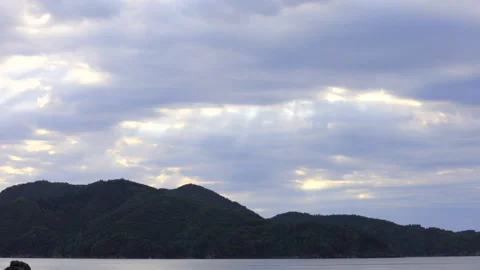 Divine sunrise through clouds over Onagawa coast. Full HD. Stock Footage 328644698
