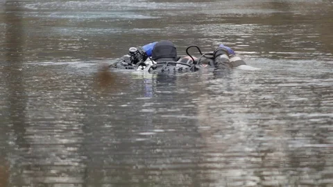 Diving Divers in the Lake Stock Footage 105264054