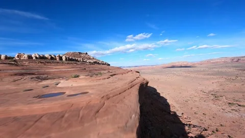 Diving Down Desert Mesa Aerial Shot of dry landscape and rock features in moab Stock Footage 156577663