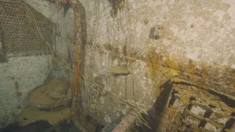 Diving into the engine room of a wrecked ship at sea Stock Footage 311844678