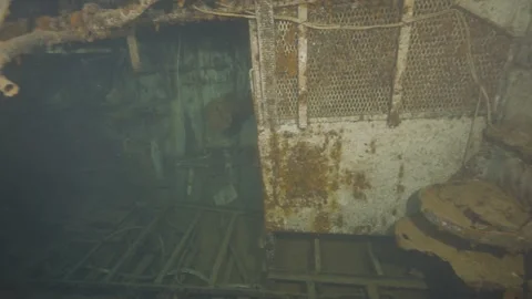 Diving into the engine room of a wrecked ship Stock Footage 311857588