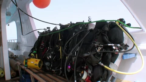 Diving equipment BCD Buoyancy Control Device on yacht deck on dive safari. Stock Footage 233514648