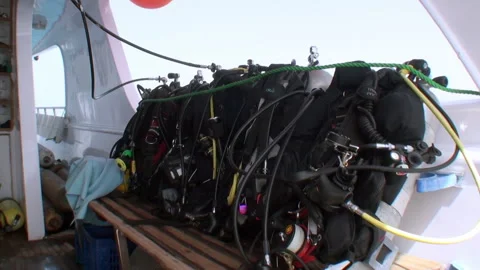 Diving equipment BCD for diving safari on bench of yacht. Stock Footage 234102523