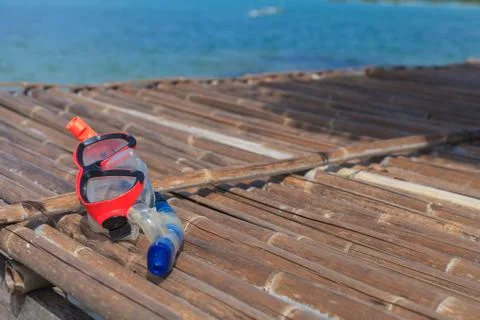 Diving Goggles on bamboo floor Stock Photos