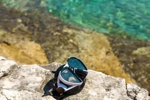 Diving goggles on the beach Stock Photos