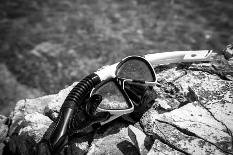 Diving goggles on the beach Stock Photos