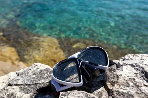 Diving goggles on the beach Stock Photos