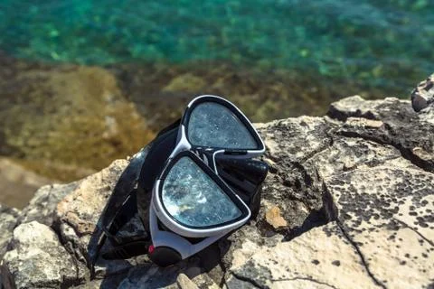 Diving goggles on the beach Stock Photos