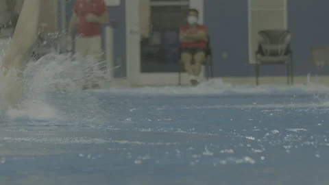 Diving Into Indoor Recreational Pool Stock Footage 165608948