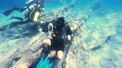 Diving instructor blows a bubble ring Stock Footage 128763698