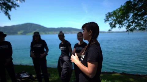 Diving instructor giving safety briefing to group of divers before scuba 動画素材 331350492