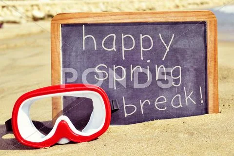 Diving mask and text happy spring break in a chalkboard Stock Photos