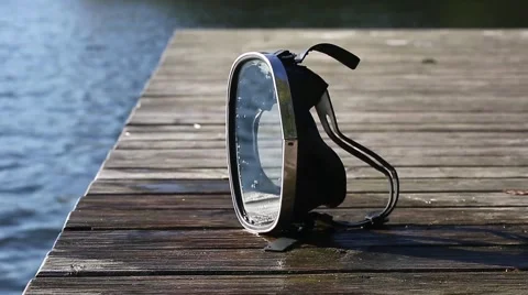Diving mask at the edge of the water bridge. Video stock 68784502