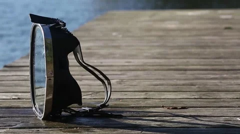 Diving mask at the edge of the water bridge. Stock-Footage 68784551