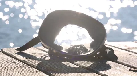 Diving mask at the edge of the water bridge. Stock Footage 68786647