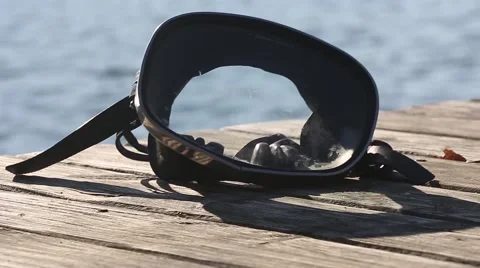 Diving mask at the edge of the water bridge. Stock-Footage 68787206