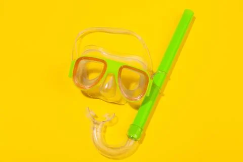 Diving mask on yellow background. Concept of beach holiday, sea tour, warm sunny Stock Photos