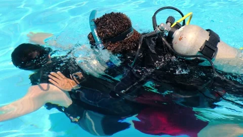 Diving in the pool. Top view of the instructor in scuba gear with an oxygen Video stock 164496641