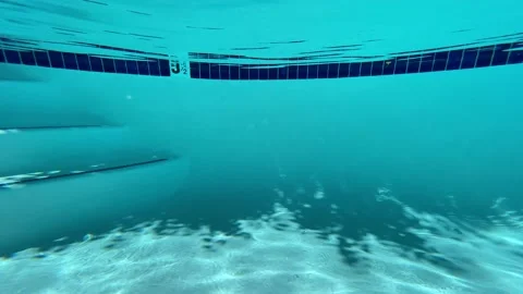 Diving in the Pool - Wide Shot Stock Footage 198594485