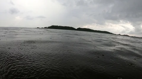 Diving into the rain in the river. Swimming in the muddy river. Stock Footage 111415775