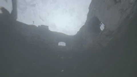 Diving under the stone ruins of a medieval building Vídeos de archivo 333708865