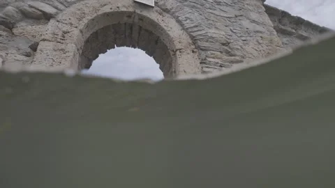 Diving under the stone structure of a medieval church in Bulgaria Stock Footage 333709202