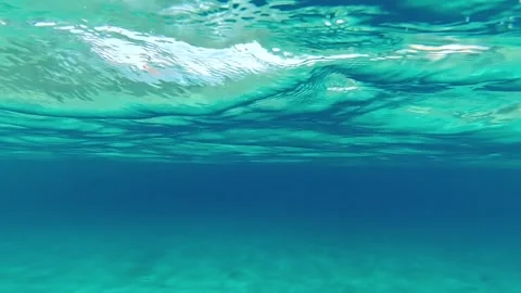 Diving under the Water Surface In crystal clear water in slow motion Stock-Footage 221991295