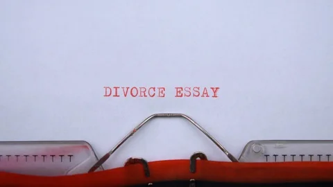 Divorce essay - phrase printed on an old typewriter in red letters, close up. Видео 129535971