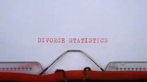 Divorce statistics - phrase printed on an old typewriter in red letters, closeup 스톡 동영상 129536078