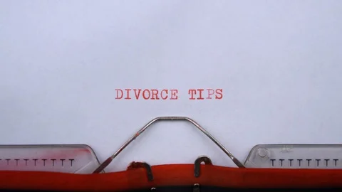 Divorce tips - phrase printed on an old typewriter in red letters, close up. 스톡 동영상 129536084