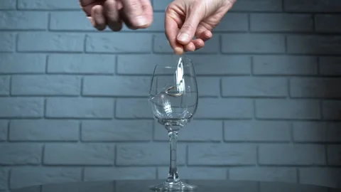 Divorcing couple with ring in glass. Stock Footage 312465602