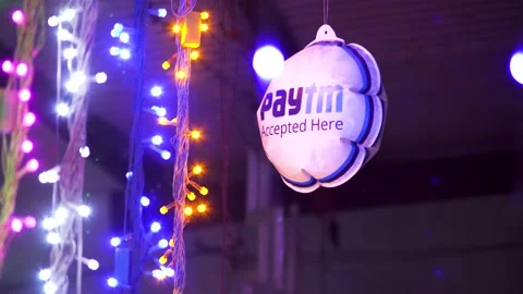 Diwali string lights of various colors along with a Paytm dangler showing the Stock Footage 165899626