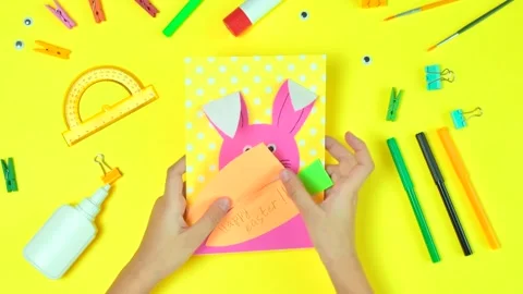 DIY and kids creativity. Step by step instruction: Create an Easter card Stock Footage 147554066