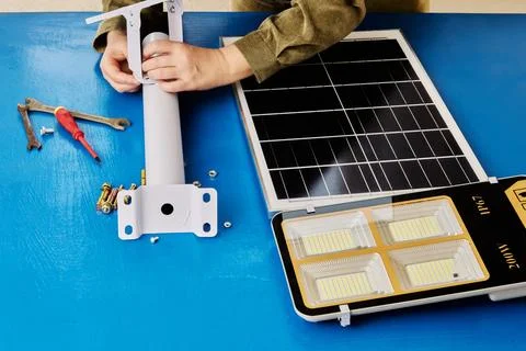 DIY assembly of mounting bracket for holder of solar panel and an LED stree.. Stock Photos