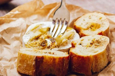 DIY baked cheese camembert instruction step by step. step 5 Camembert tasting Stock Photos