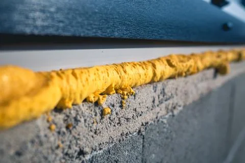 DIY concept. Construction PU - poly urethane foam. The window is installed using Stock Photos