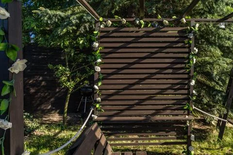 DIY construction of a decorative wall made of planks in the garden, a woode.. Stock Photos