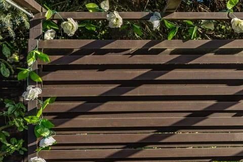 DIY construction of a decorative wall made of planks in the garden, a woode.. Stock Photos