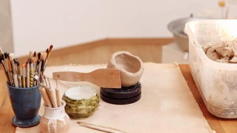 DIY create a Cup of clay by hand modeling. Step 5. Align the outer surface Stock Photos