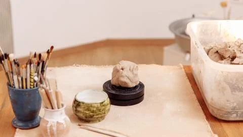DIY create a Cup of clay by hand modeling. Step 2. Mash the clay in your hands. Stock Photos