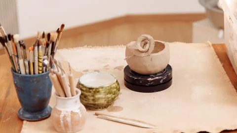 DIY create a Cup of clay by hand modeling Step 6 Removing the top layer from Cup Stock Photos