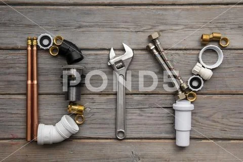 DIY, Do it yourself word made from plumbing equipment and tools Stock Photos