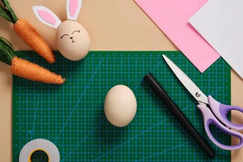 DIY Easter Bunny Egg Craft. Step-by-step instructions. Take an egg, light-col Stock Photos