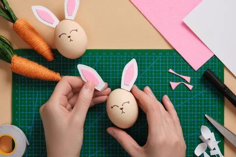 DIY Easter Bunny Egg Craft. Step-by-step instructions. Step 6. Glue the ear.. Stock Photos