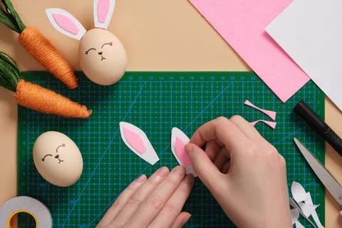 DIY Easter Bunny Egg Craft. Step-by-step instructions. Step 5. Glue the pin.. Stock Photos